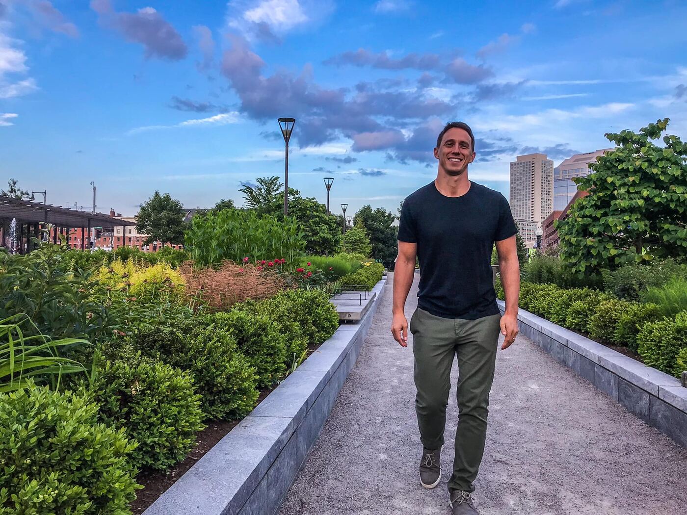 Dylan Lennon walking through a park